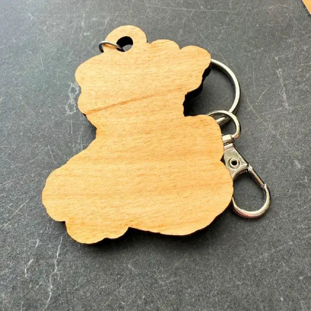 Back of I love my pitbull keychain on a dark surface
