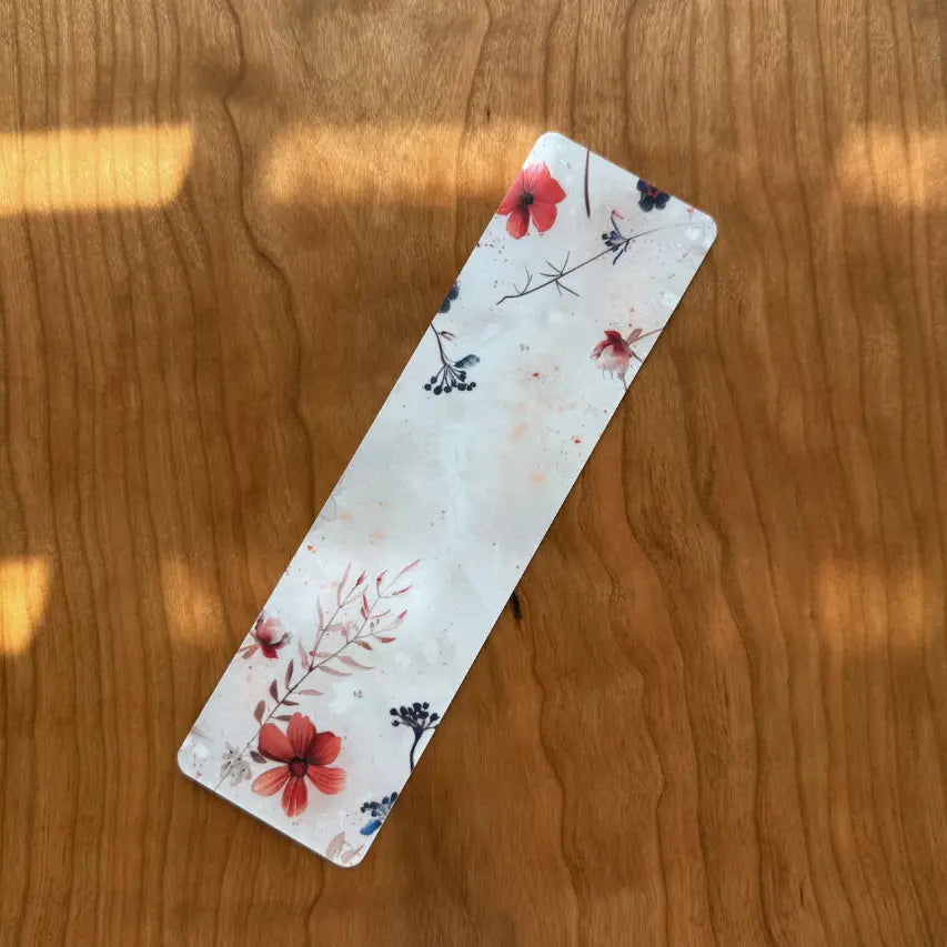 Floral bookmark on a wooden surface