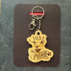 Wooden keychain with 'I love my Pitbull' text on a black card