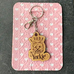 Keychain with 'Love Yorkie' tag on a pink card with heart pattern