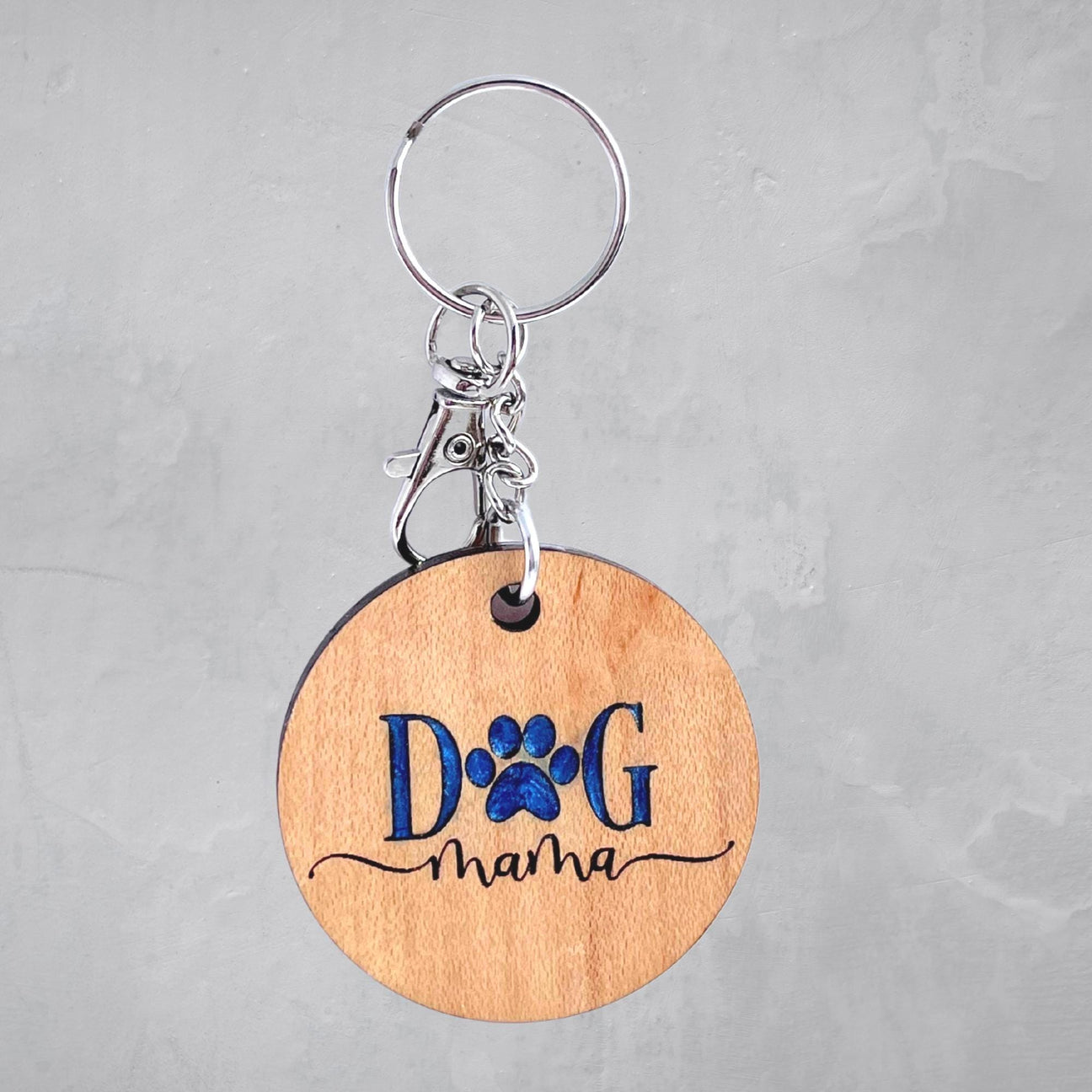 Engraved “Dog Mama” keychain with blue resin inlay on key ring