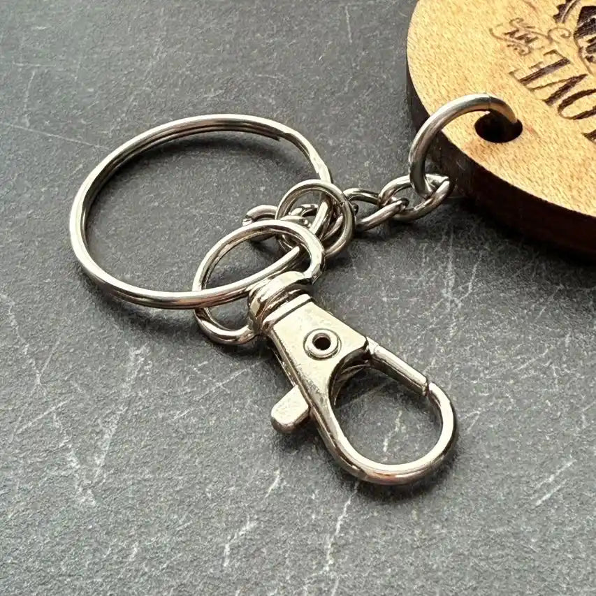 silver lobster clasp with keyring on dark grey background